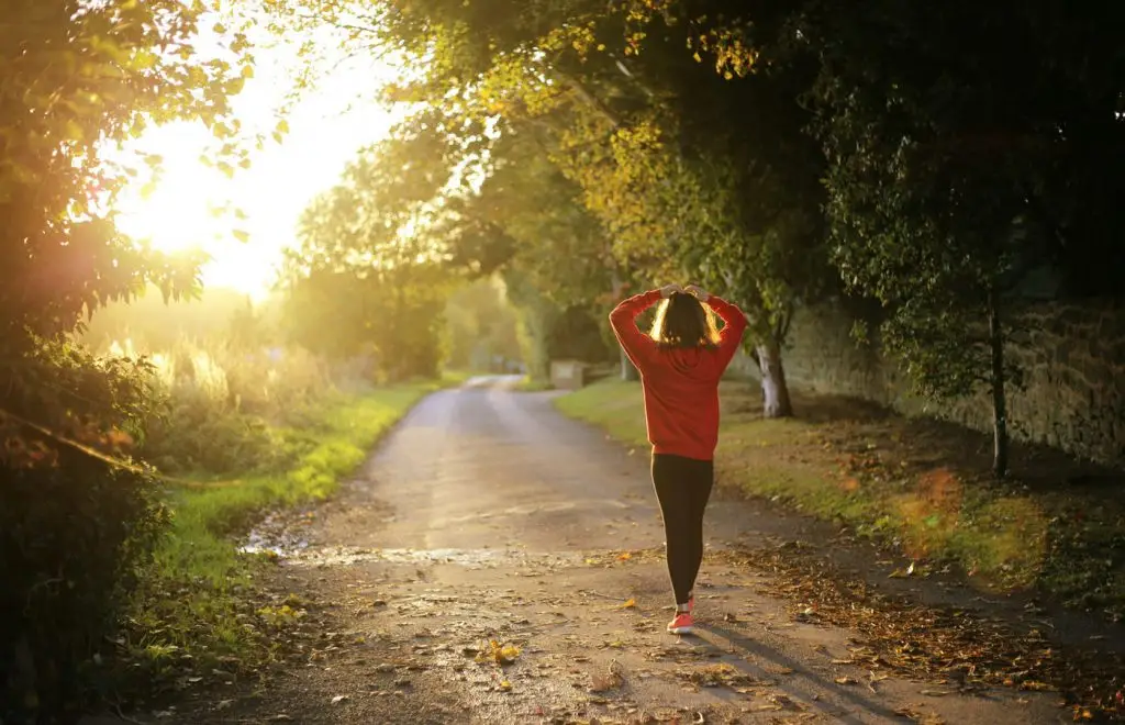 Woman jogging on a trail in the country