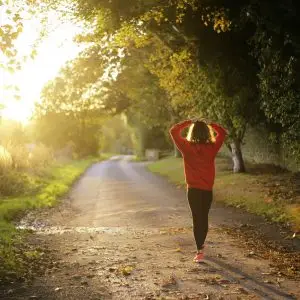 Woman jogging on a trail in the country