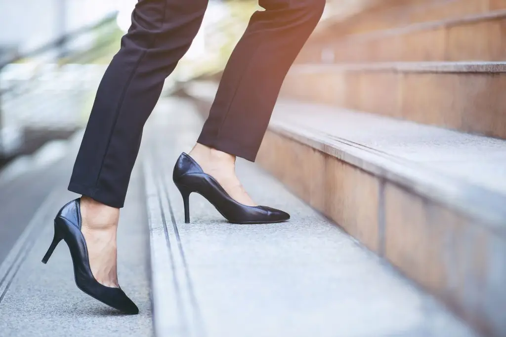 Businesswoman walking up the stairs