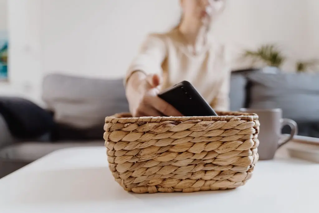 Woman putting her phone aside.