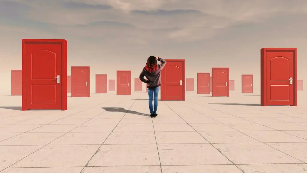 Woman looking into the distance at multiple doors trying to choose which one to go through