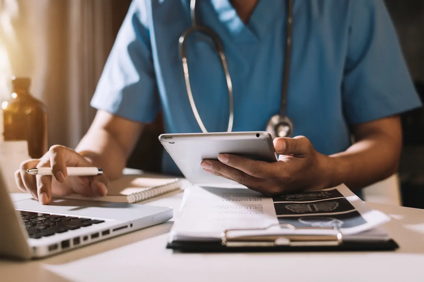 Medical technology concept. Doctor working with mobile phone and stethoscope in modern office